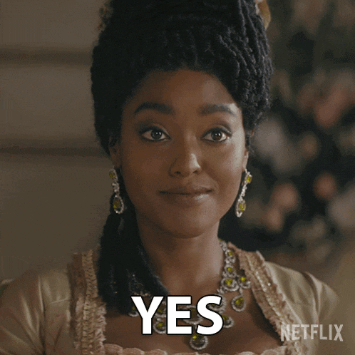 a woman with dreadlocks and a necklace says yes