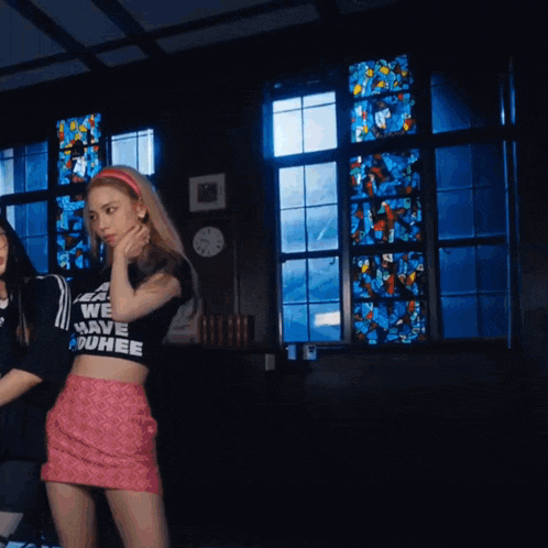 a girl wearing a crop top that says least we have duhee