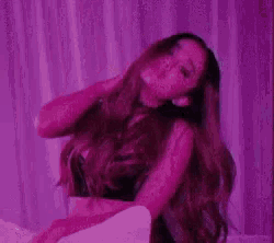 a purple background with a silhouette of a person walking on it