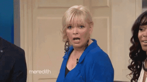 a woman in a blue shirt is making a funny face with meredith written on the bottom