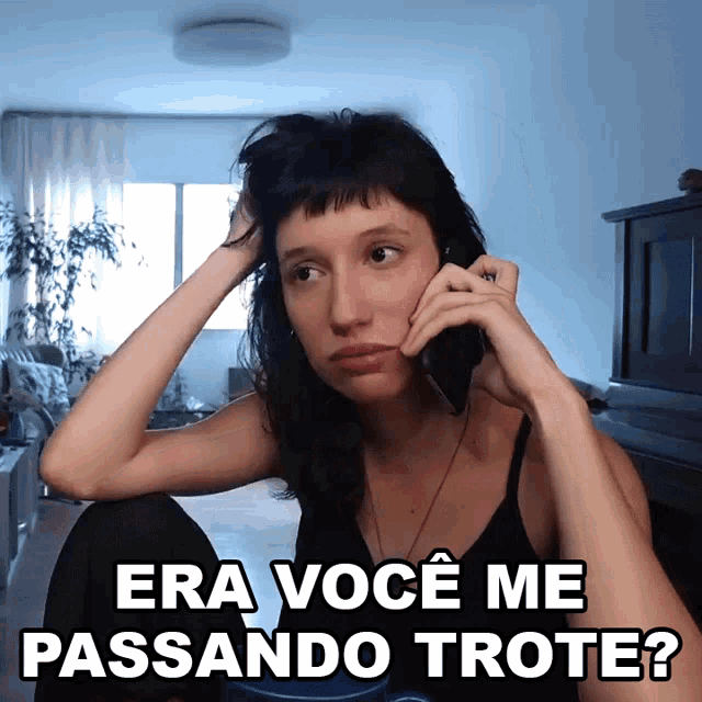 a woman talking on a cell phone with the words era voce me passando trote