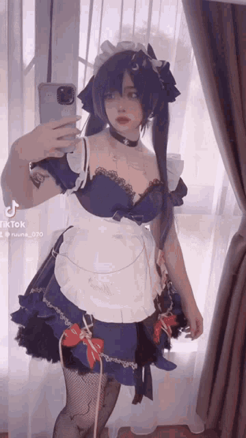 a girl in a maid costume takes a selfie