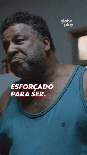 a man in a blue tank top says globo play on the bottom right