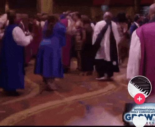 a group of people dancing in front of a sign that says grow