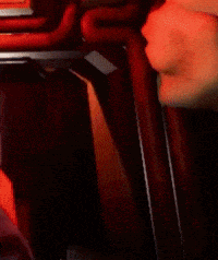 a close up of a person 's face with a red eye