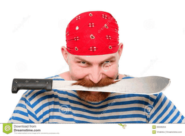 a man with a red bandana and a beard is holding a large knife in his mouth
