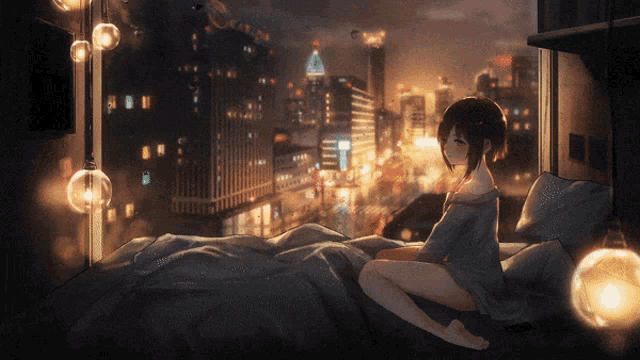 a girl is sitting on a bed looking out a window at a city at night