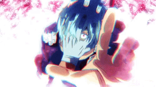 a close up of a person covering their face with their hands in front of a pink background .