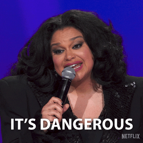 a woman singing into a microphone with the words " it 's dangerous " written below her
