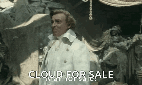 a man in a white coat is standing in front of a wall that says cloud for sale