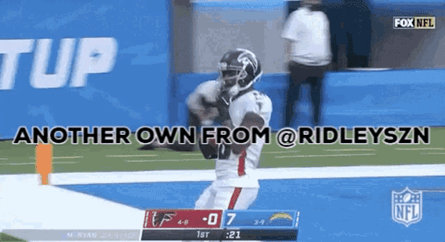 a football player is running on a field with the words another own from @ridleyszn above him