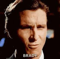 a close up of a man 's face with the words brady written on his face .
