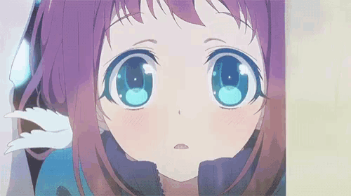 a close up of a girl 's face with blue eyes and purple hair