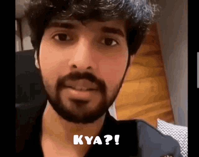a man with a beard is asking the question kya