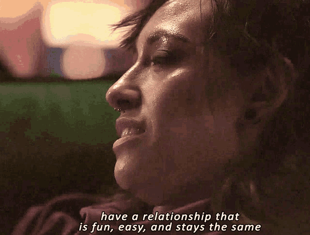 a close up of a woman 's face with the words have a relationship that is fun easy and stays the same below her