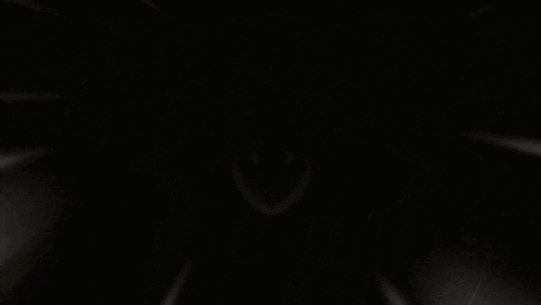 a black background with a smiley face in the middle