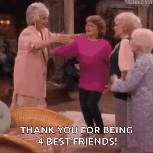 a group of older women are standing next to each other and hugging .