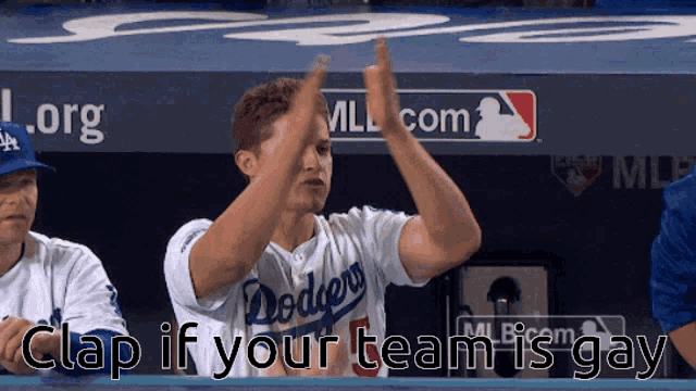 a dodgers baseball player giving a high five
