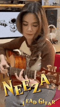 a girl is playing a guitar with the name neeza lead guitar on the bottom