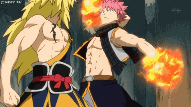 two anime characters are fighting each other with one holding a fireball .
