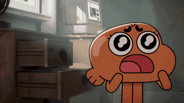 darwin from the amazing world of gumball is standing in front of a computer