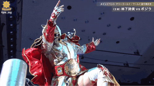a man in a red and silver costume with a gold belt stands in front of a sign that says pw mg