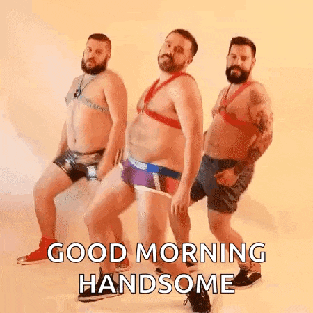 a group of men in underwear are dancing together and saying good morning handsome .