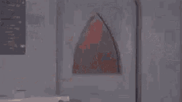 a pixelated image of a man in a red spiderman costume