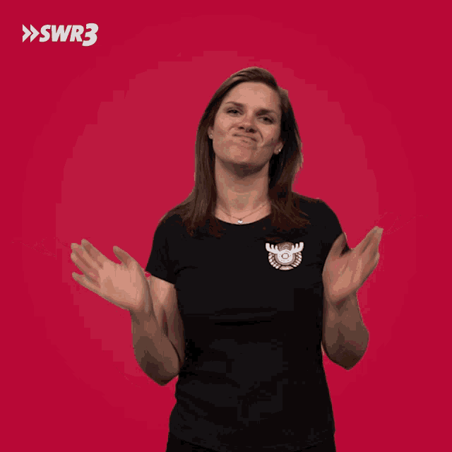 a woman wearing a black shirt with a moose on it