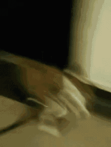 a close up of a person 's arm with a black background