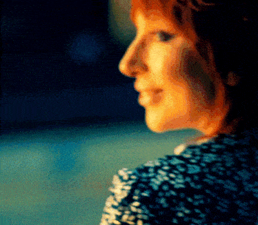 a woman 's face is shown in a blurry photo