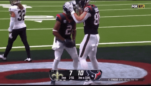 a football game is being played with the score 7 to 10