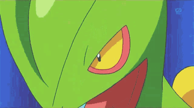 a green snake with a long tongue sticking out of its mouth .