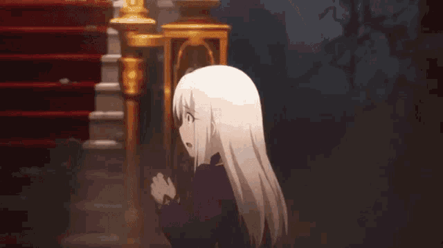 a girl with long white hair is standing in a dark room with stairs in the background .