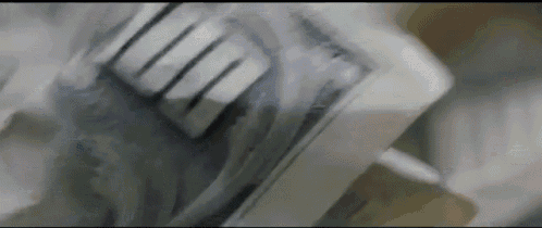 a close up of a stack of money on a table with a fork in it .