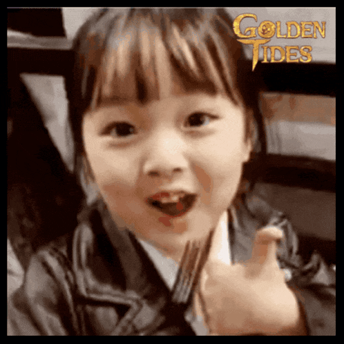 a little girl is holding a fork and giving a thumbs up with the words golden tides in the background