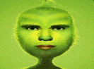 a close up of a cartoon character 's face with a green hairy head .