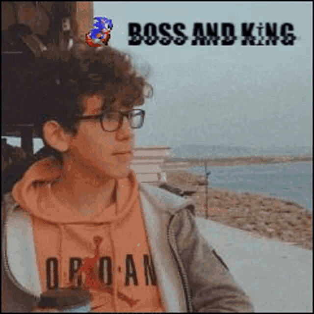 a young man wearing glasses and a hoodie that says o.p.o.a.n.