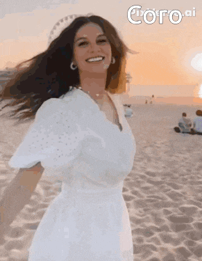 a woman in a white dress is standing on a beach .