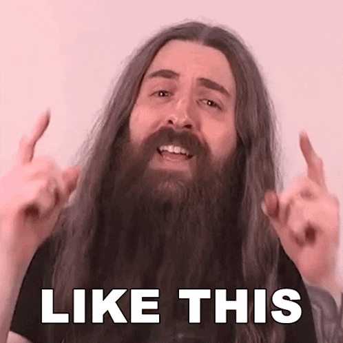 a man with a beard and long hair is making a funny face and says `` like this '' .