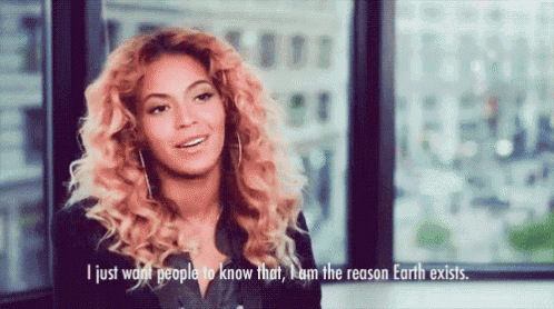 a woman with curly hair is talking and says " i just want people to know that i am the reason earth exists "