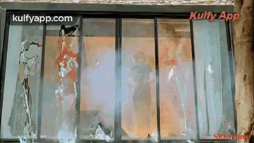 a sliding glass door with the words kulfyapp.com on the bottom