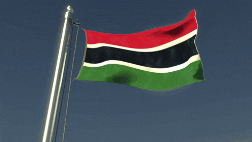 a flag with a red white and green stripe is waving in the wind