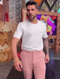 a man in a white t-shirt and pink pants