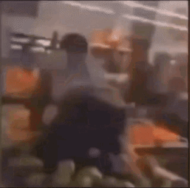 a blurry picture of a person standing in a grocery store aisle