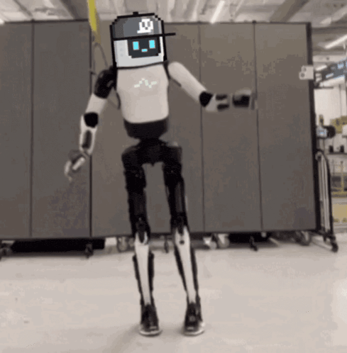 a black and white robot with a pixelated face and a hat with the letter x on it