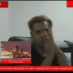a man is sitting in front of a screen that says rp 28,698