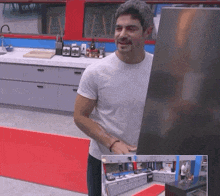 a man in a white shirt is standing in front of a refrigerator