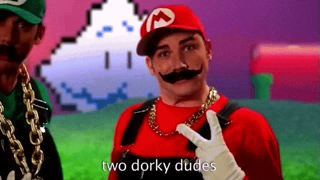 a man in a mario costume is giving a peace sign