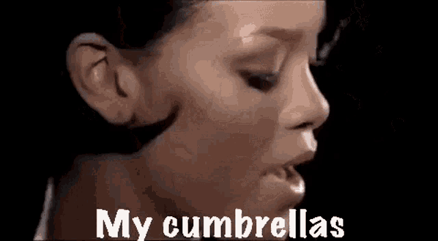 a close up of a woman 's face with the words `` my cumbrellas '' written in white letters .